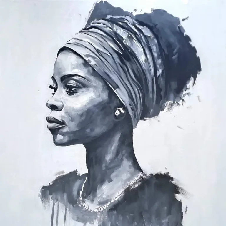 Monochrome portrait of a woman in a headwrap and necklace